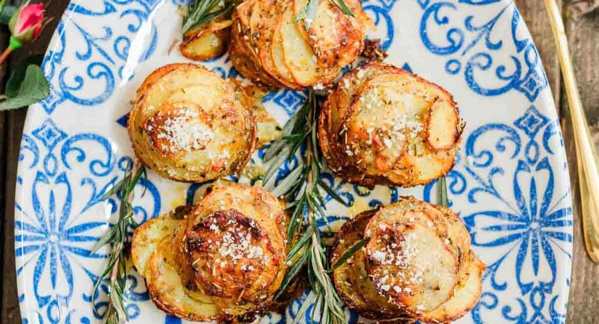 Overhead image of chipotle herbs muffin tin potatoes with garnish.