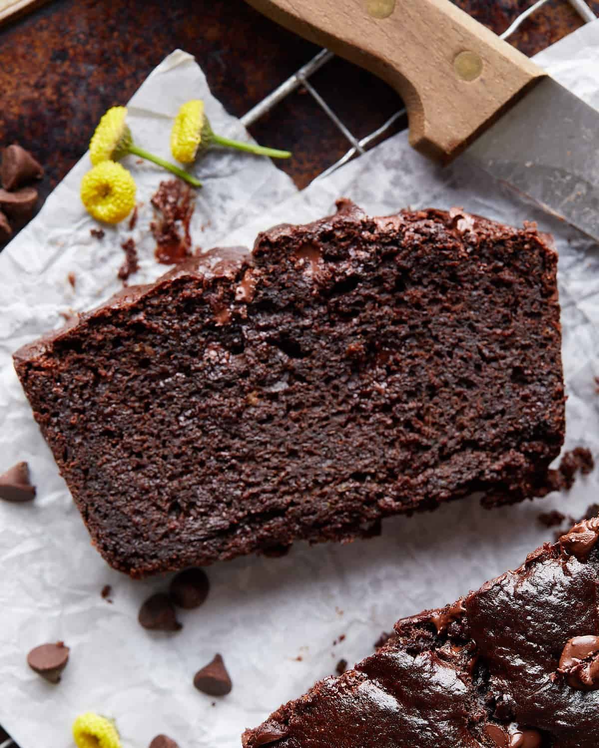 Up close photo of chocolate olive oil zucchini bread slice.