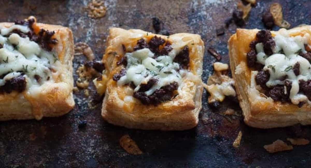 Overhead image of chorizo tarts with apple and thyme.