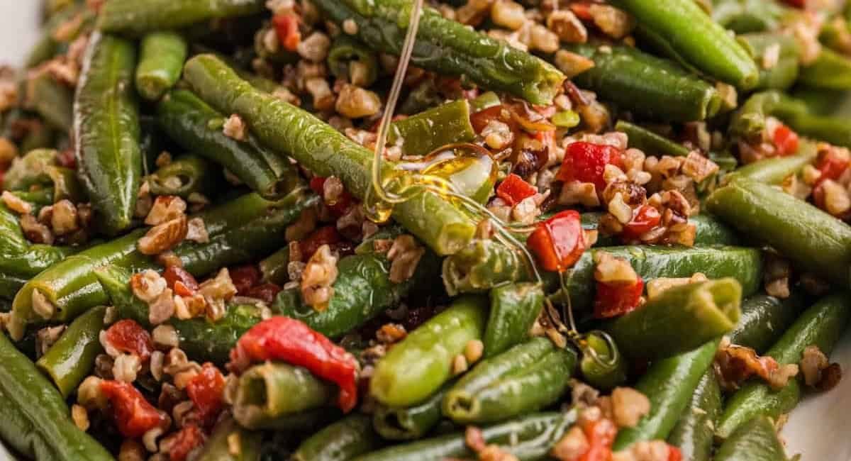 Up close image of honey-caramelized pecan Christmas green beans.