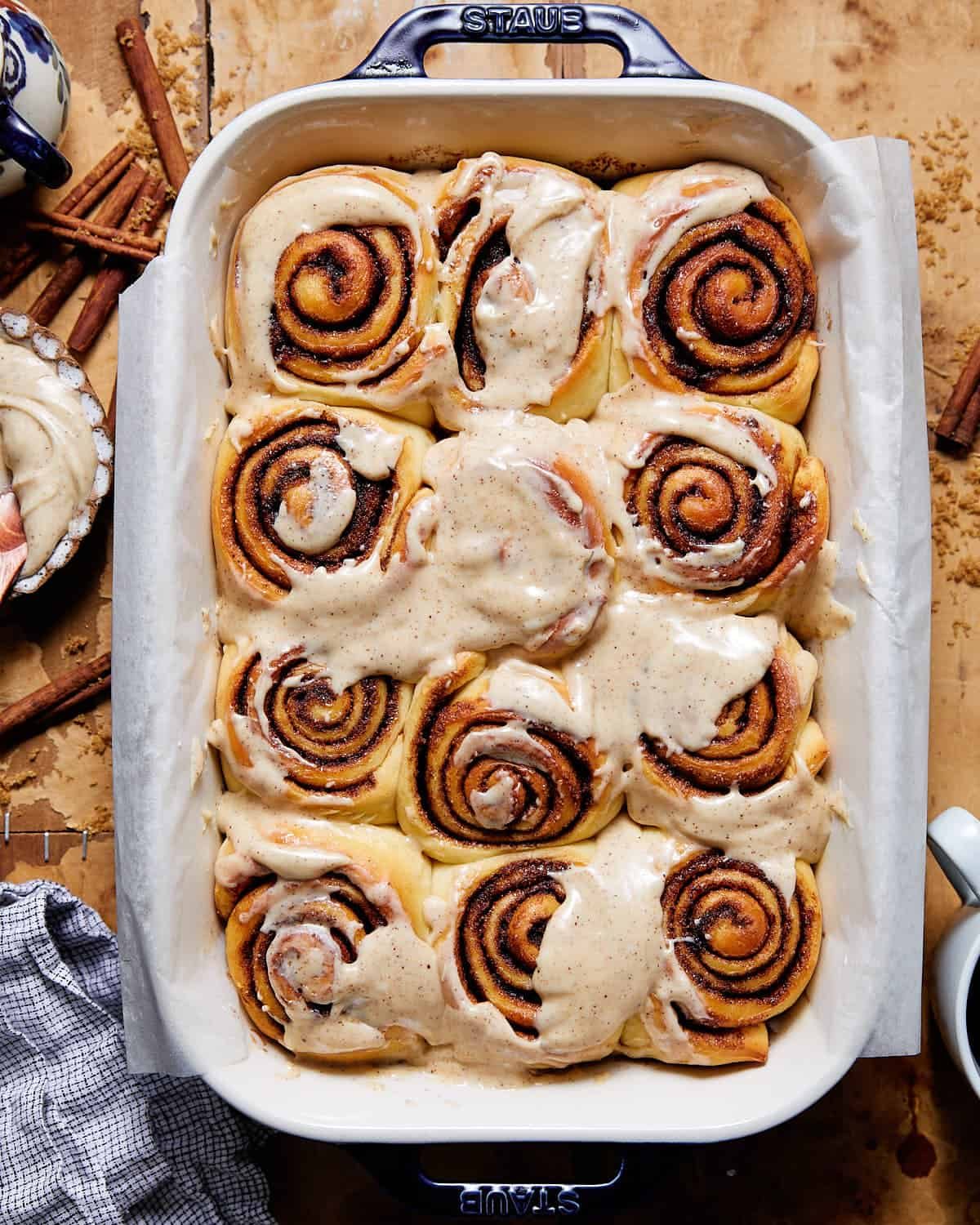 Overhead image of baking dish with fresh brown butter cinnamon rolls.
