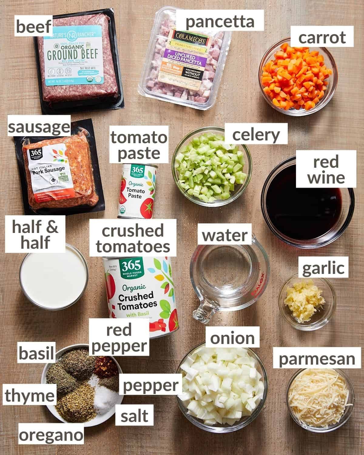 Overhead shot of ingredients for creamy bolognese in glass bowls.