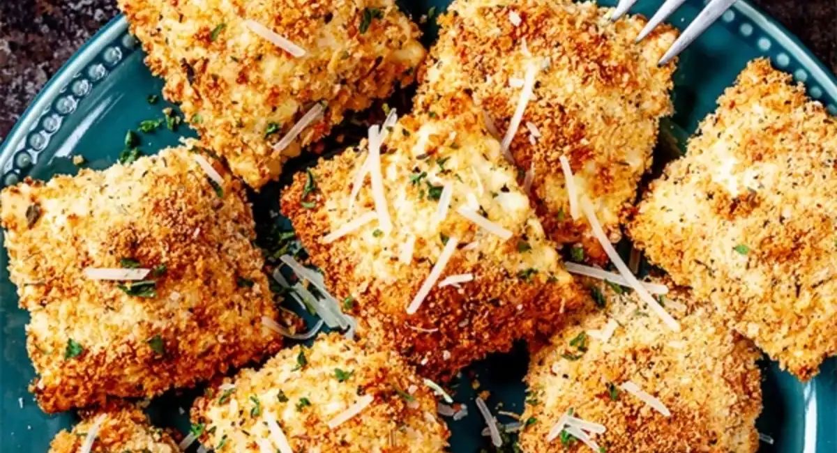 Overhead image of crispy toasted ravioli with garnish.