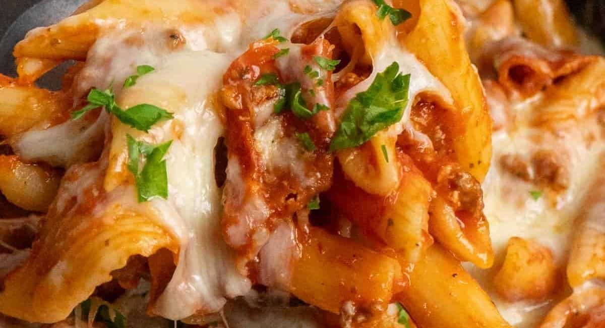 Up close image of crock pot pizza casserole with garnish.