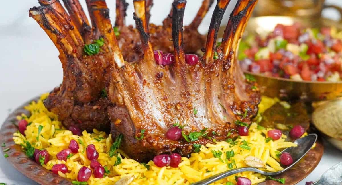 Up close image of pomegranate lam and saffron rice.