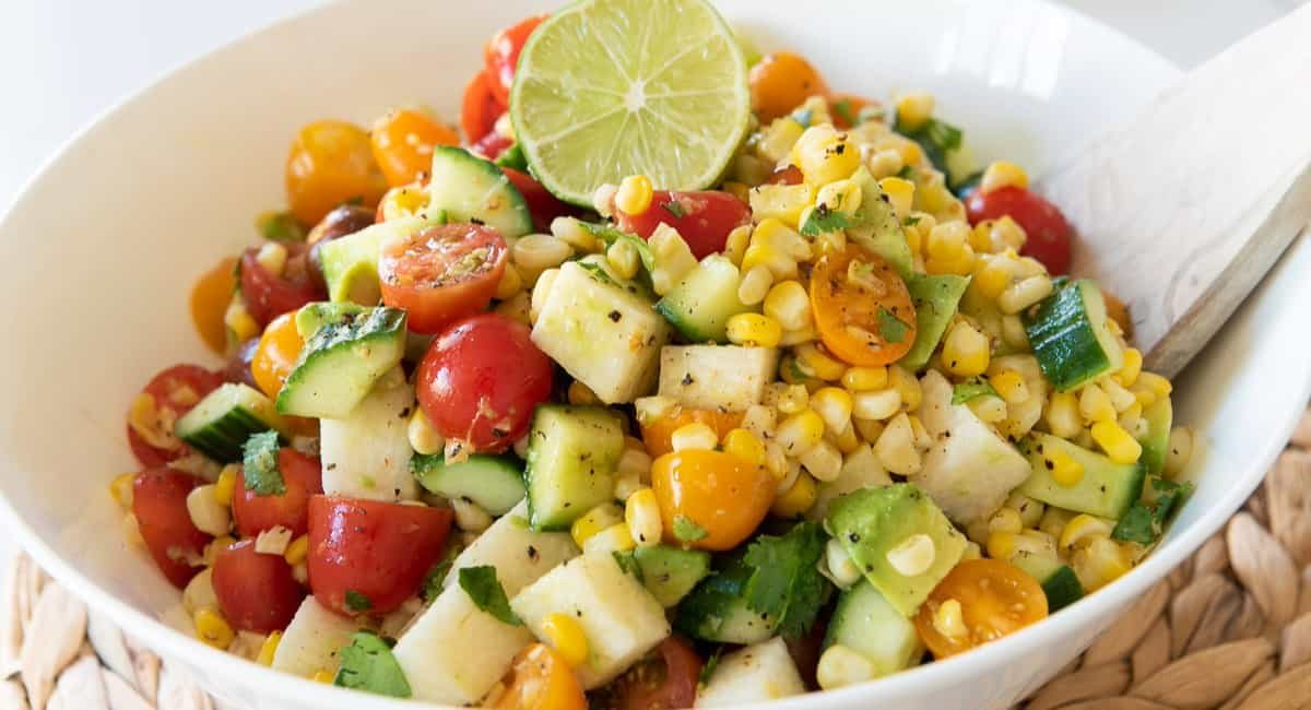Up close image of grilled corn avocado salad with lime vinaigrette.