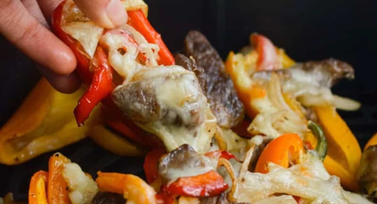 Up close image of air fryer Philly cheesesteak stuffed peppers.