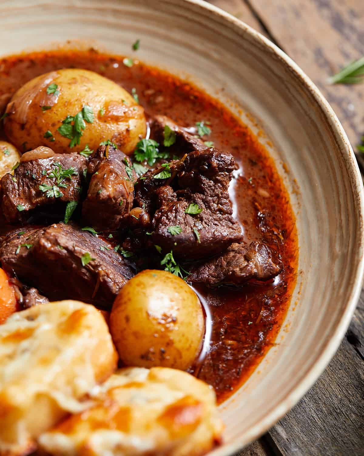 Up close image of dutch oven beef stew with red wine.