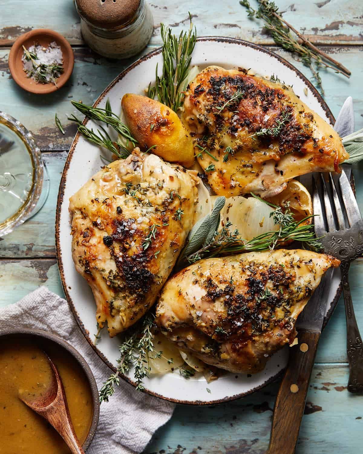 Dutch oven chicken breast on a white dish.