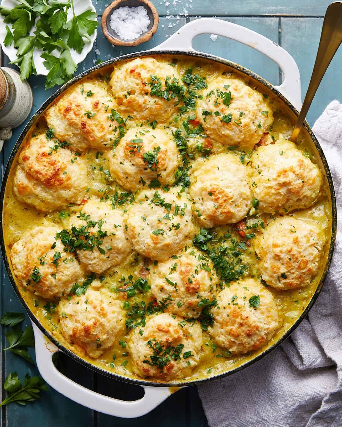 Overhead image of dutch oven chicken pot pie with biscuits.