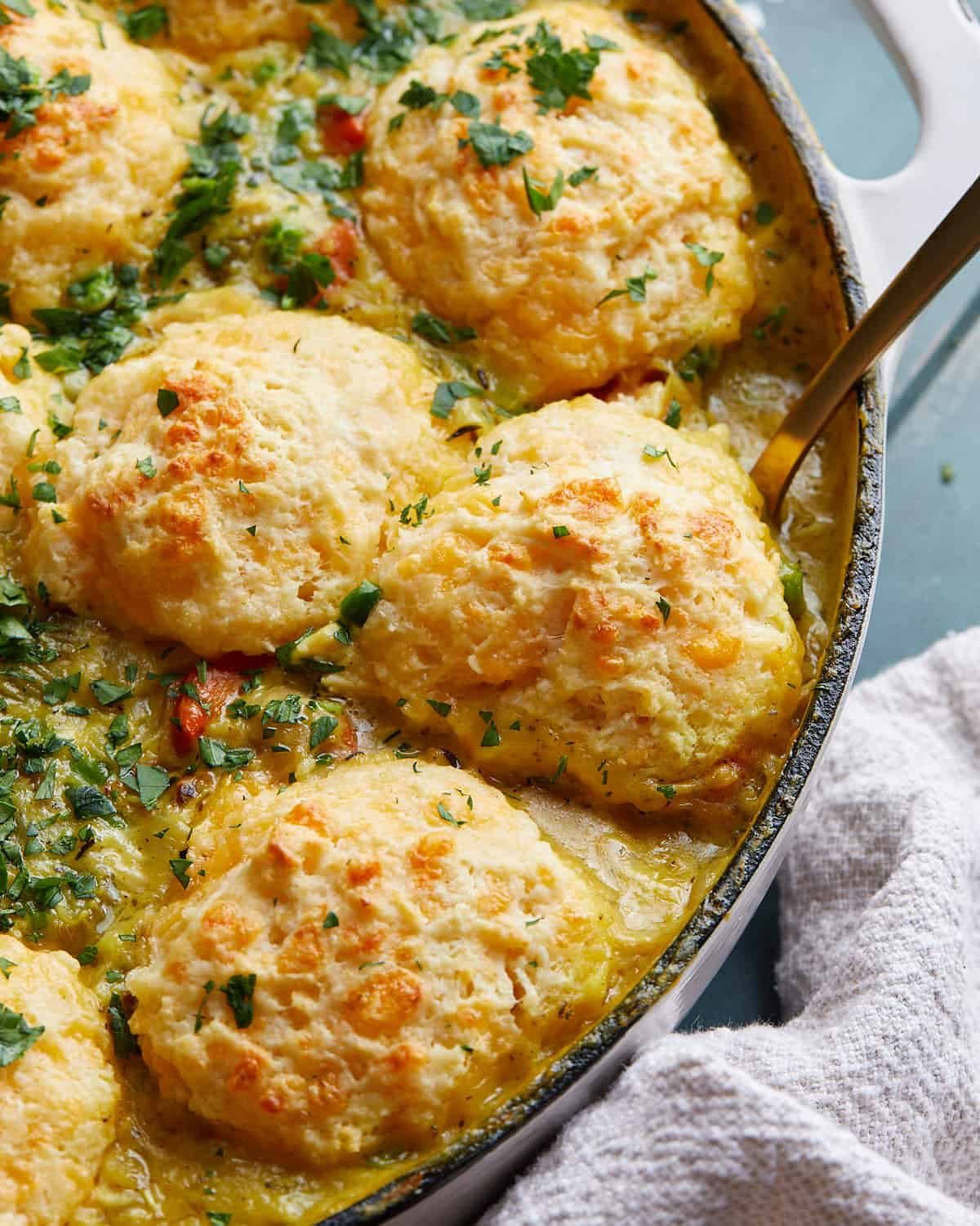 Up close photo of chicken pot pie with cheddar biscuit topping.
