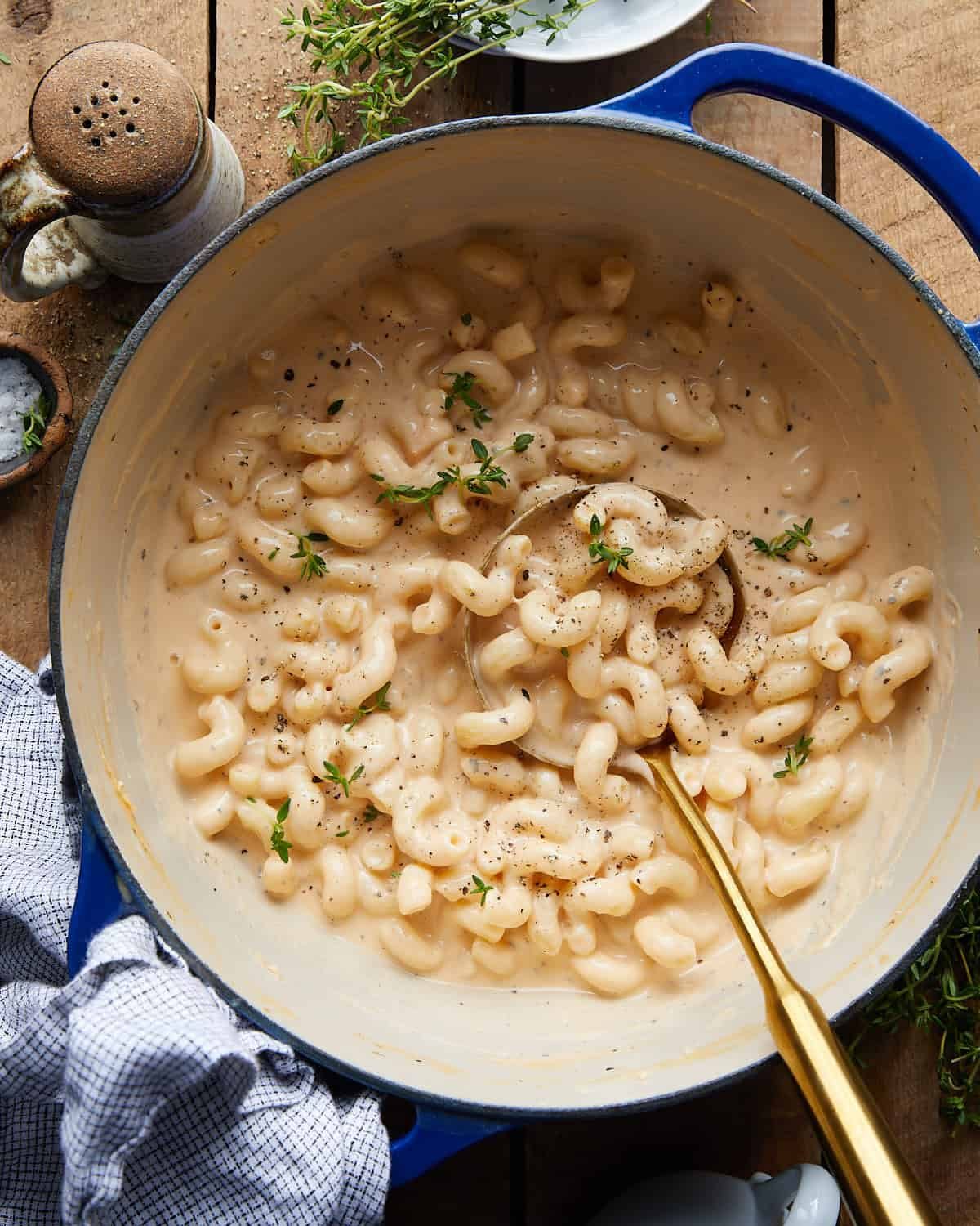 Overhead image of dutch oven mac and cheese with garnish.
