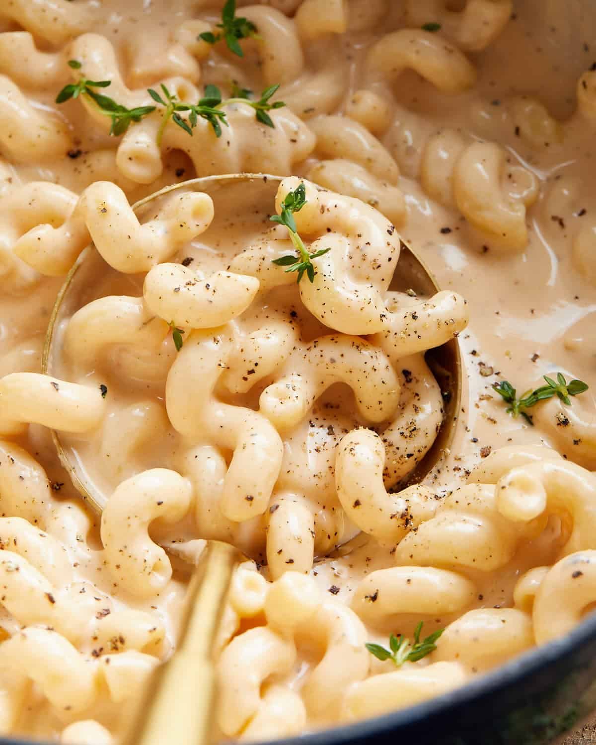 Up close image of dutch oven mac and cheese with garnish.