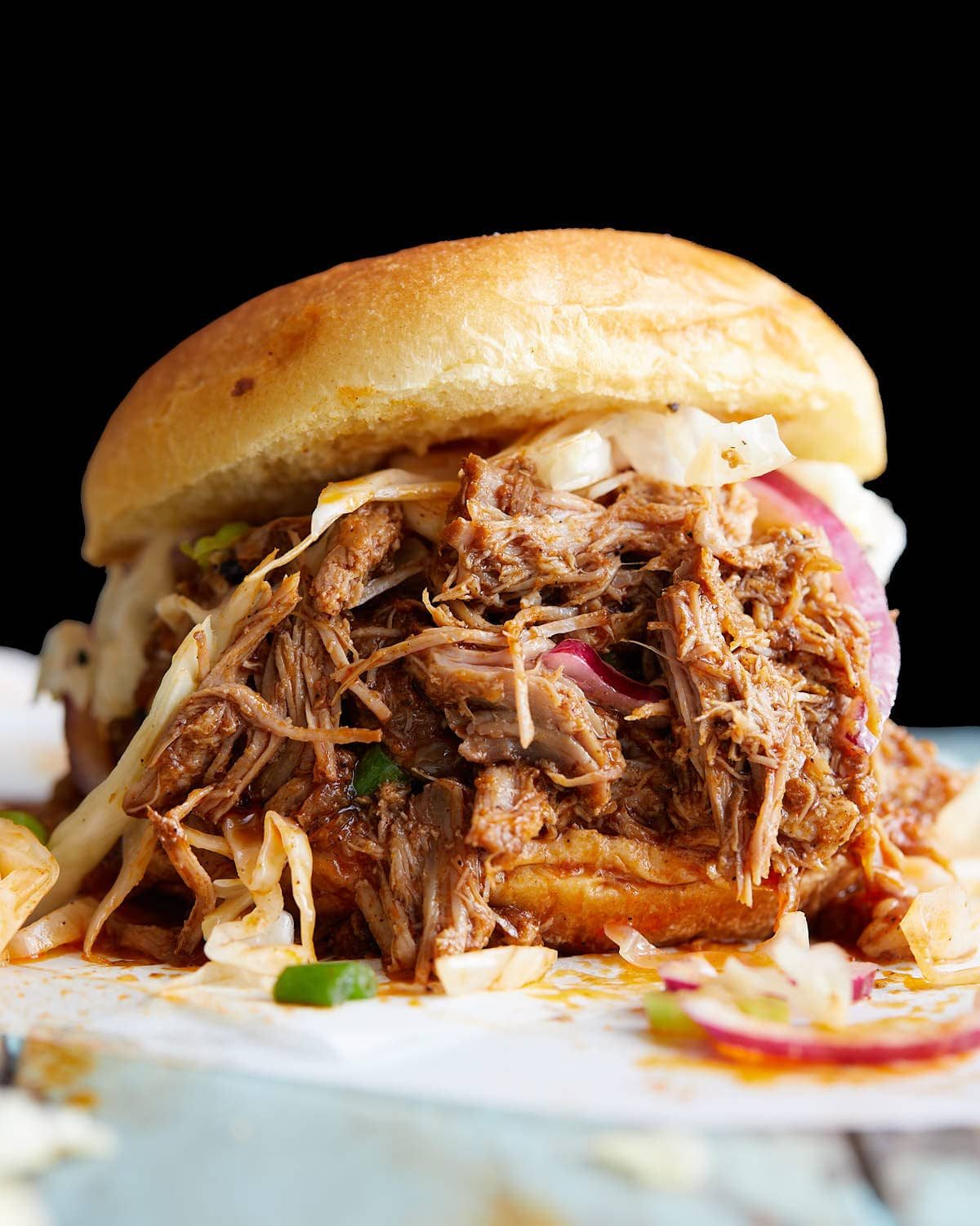 Up close image of pulled pork sandwich.