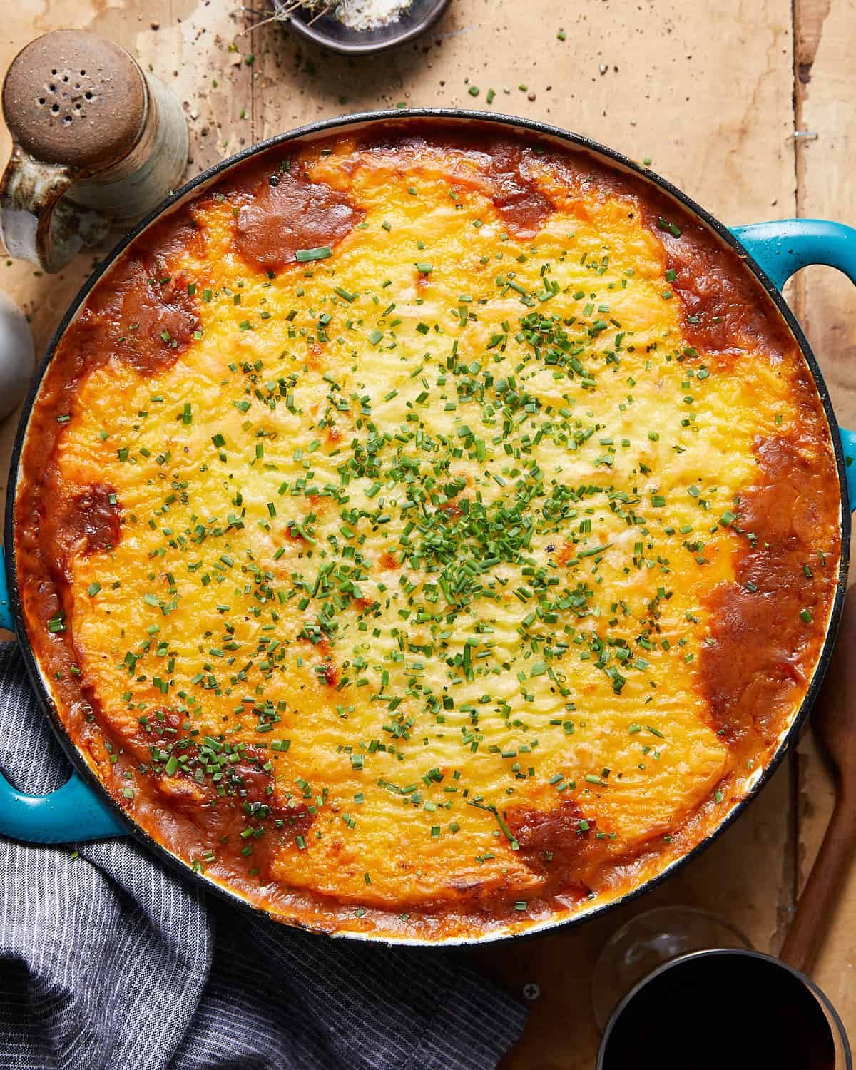 Overhead image of dutch oven shepherds pie in blue dish.