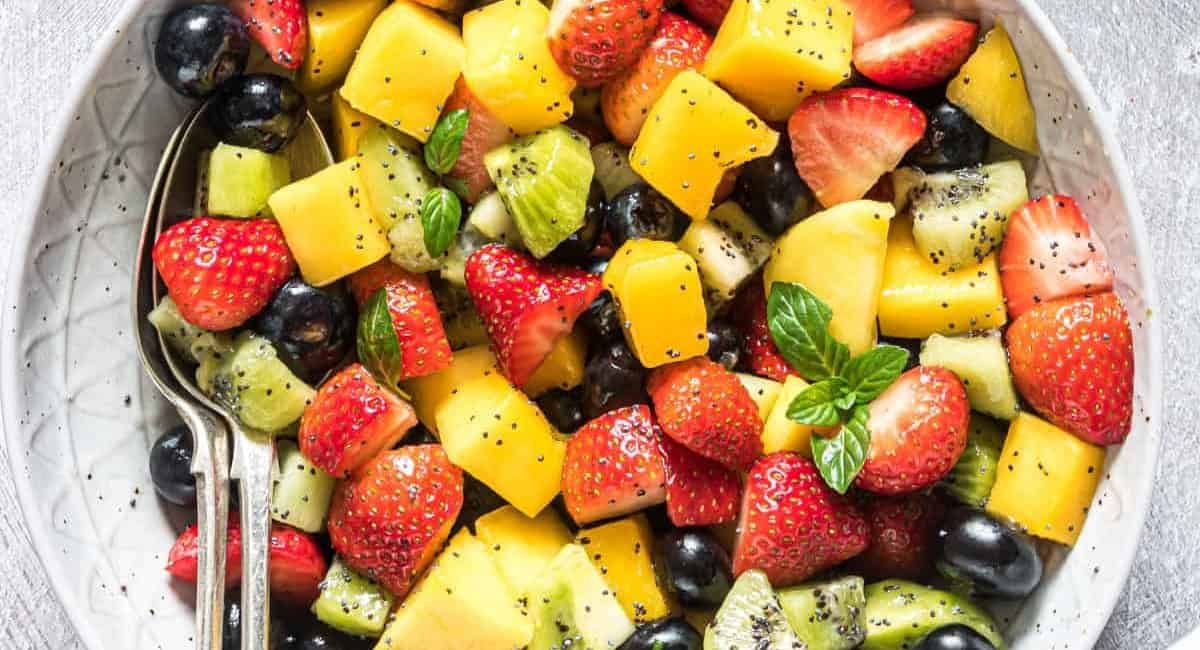 Overhead image of fruit salad with poppy seed dressing.