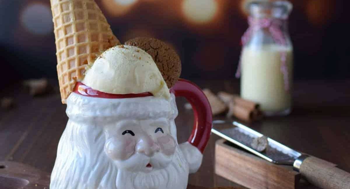 Image of eggnog ice cream in Santa mug with gingersnap.