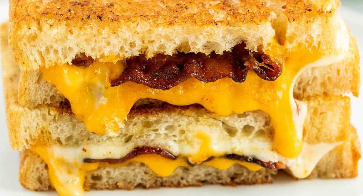 Side profile image of bacon grilled cheese sandwich.