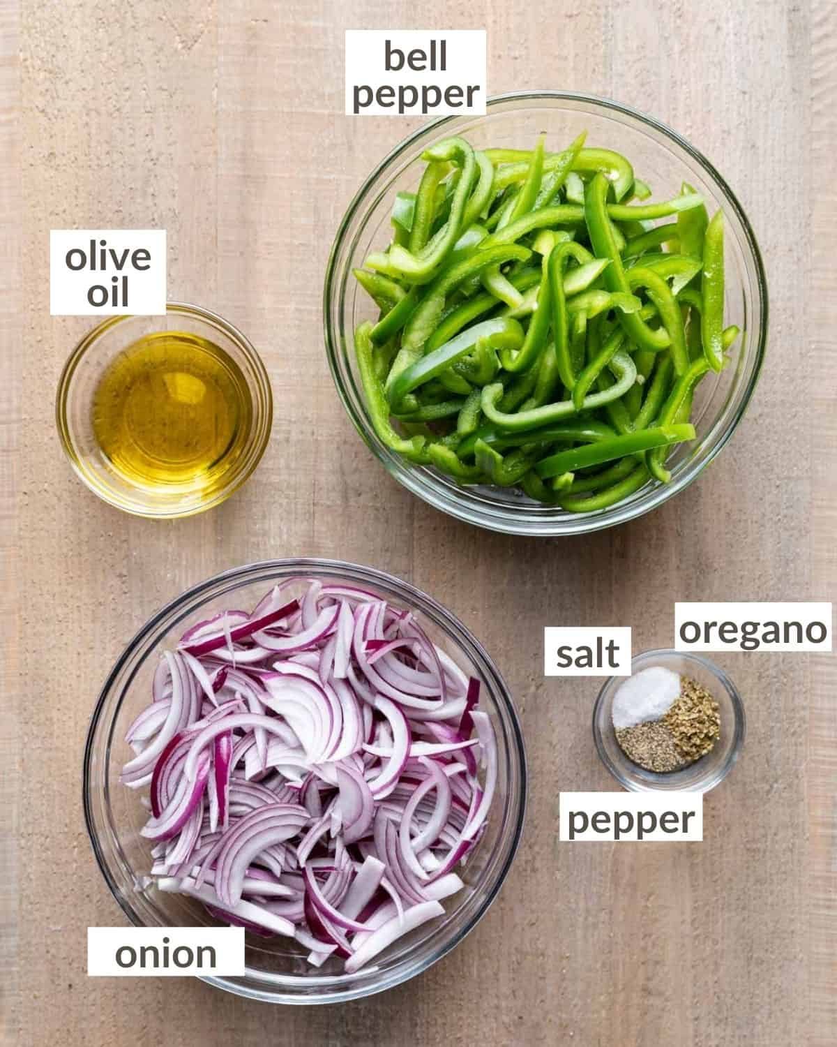 overhead of ingredients in glass bowls for fajita veggies chipotle