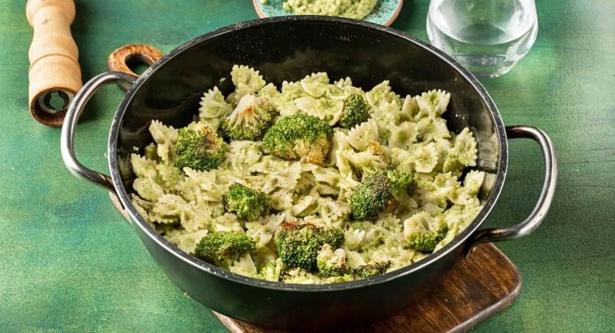 Overhead image of farfalle with broccoli pesto.