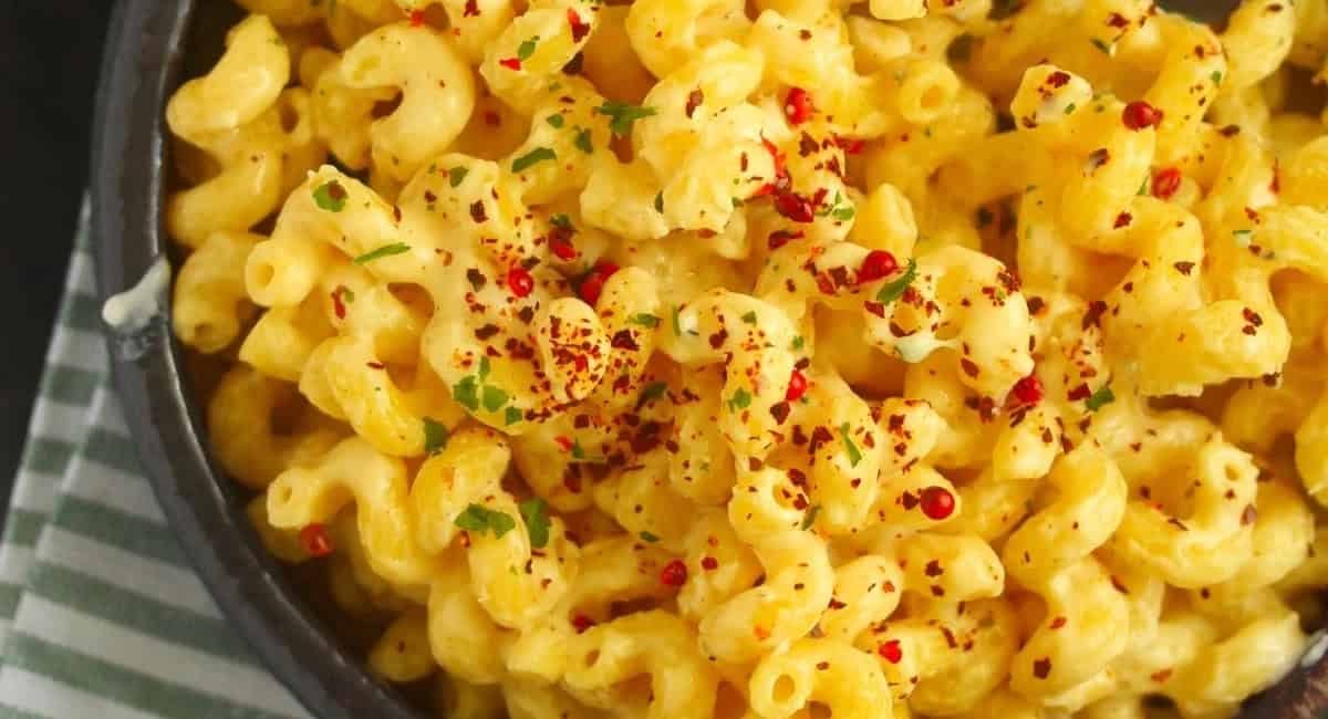 Overhead image of five cheese mac and cheese with garnish.