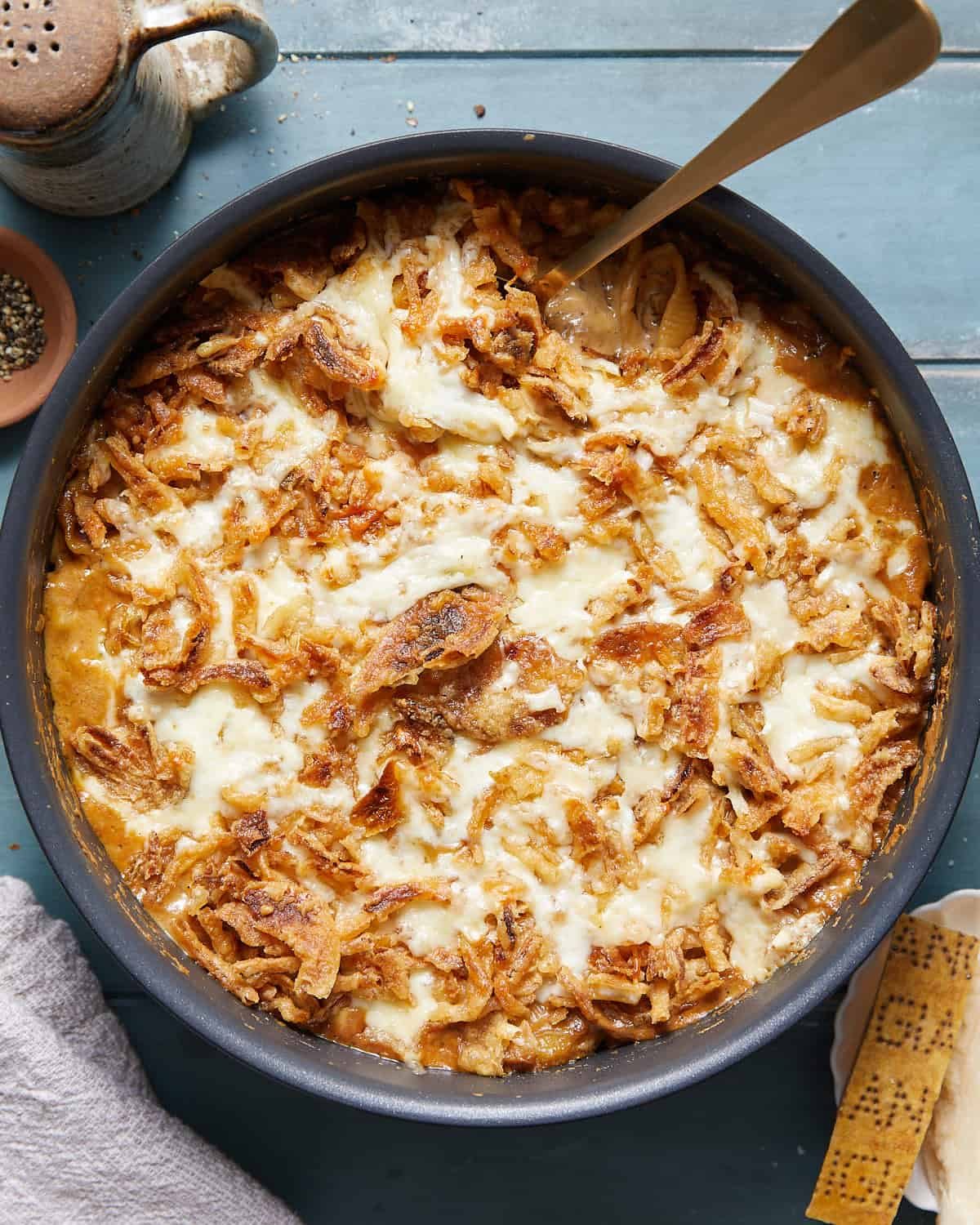 Overhead image of french onion mac and cheese in black skillet pan.