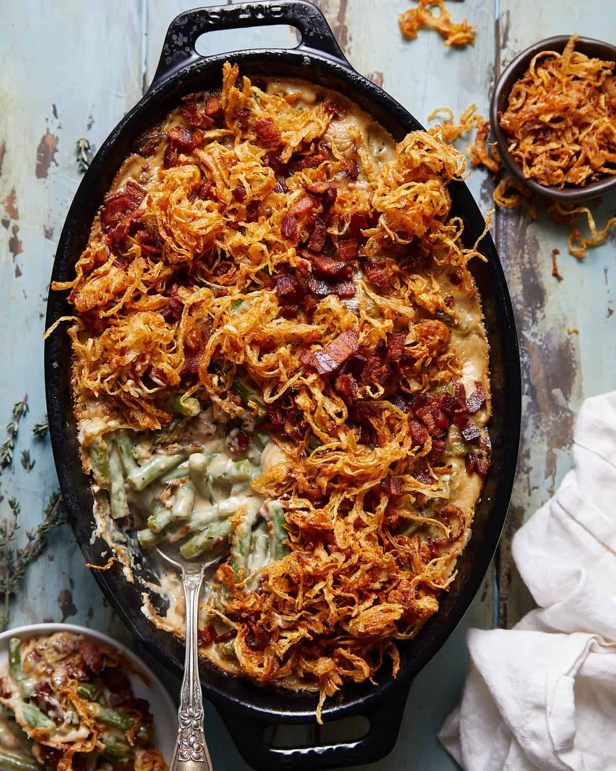 Overhead image of green bean casserole with bacon and mushrooms.