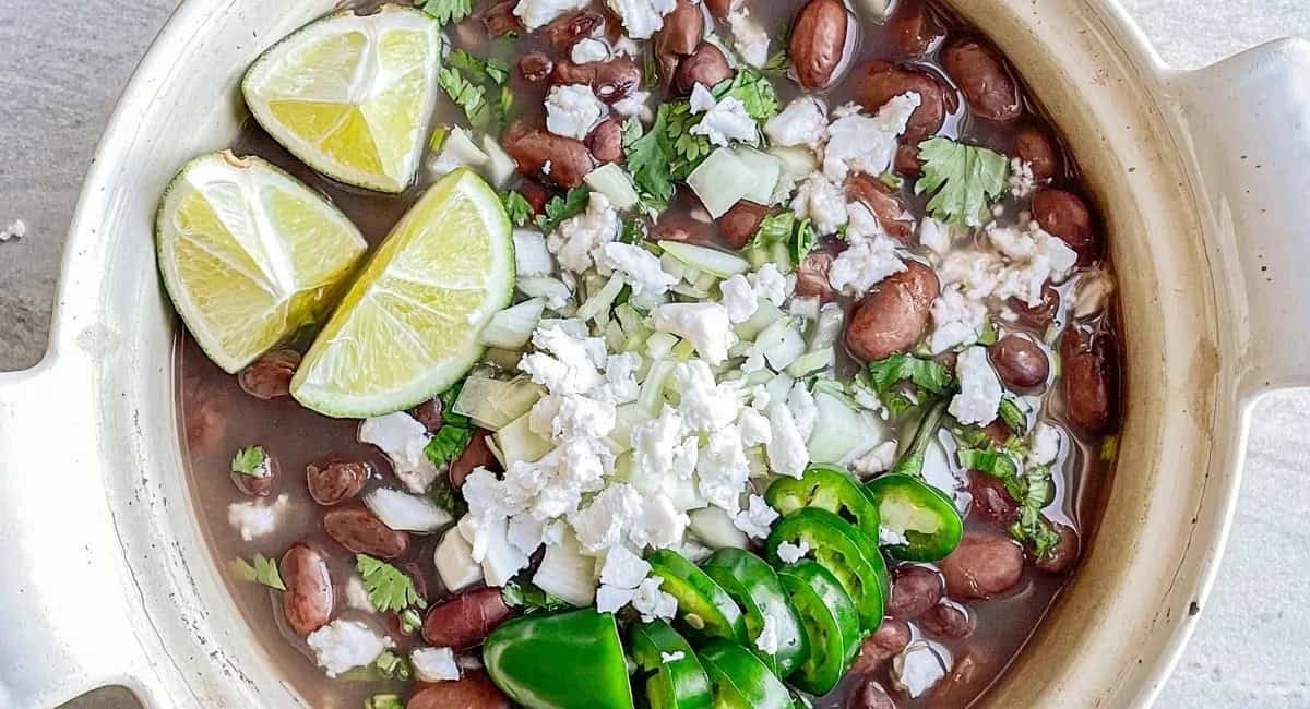 Overhead image of frijoles de la olla with garnish.