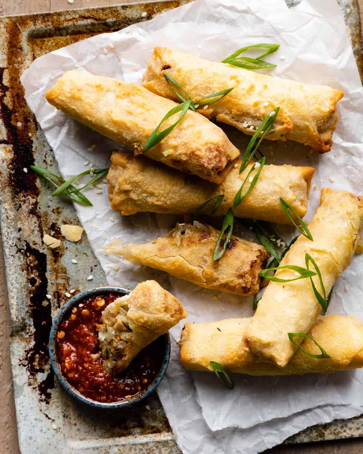 Overhead image of air fryer frozen egg rolls.