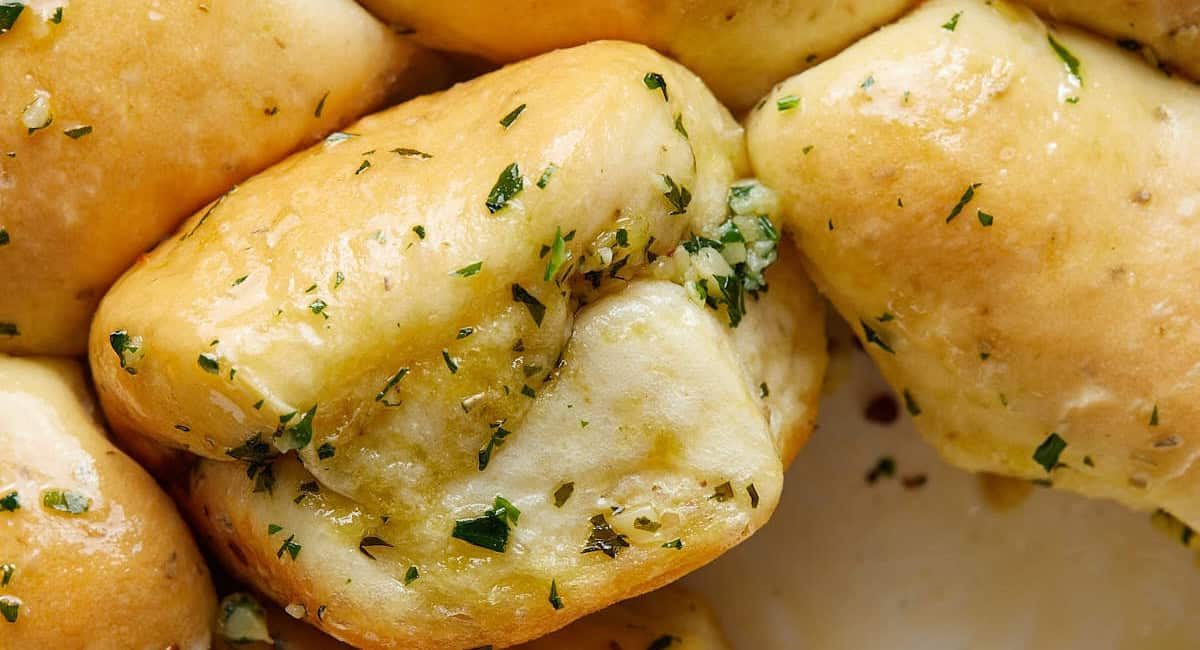 Up close image of garlic bread roll.