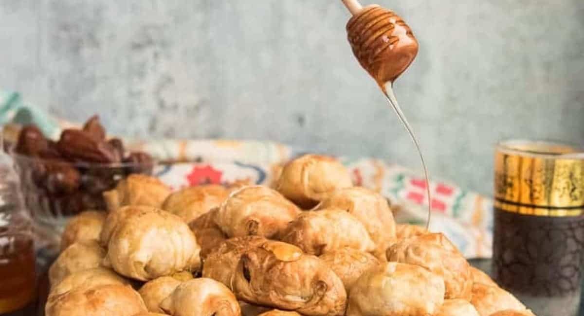 Side profile image of goat cheese-stuffed dates in puff pastry.