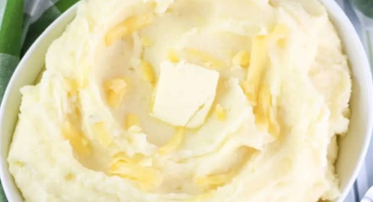 Overhead image of gouda mashed potatoes with butter.