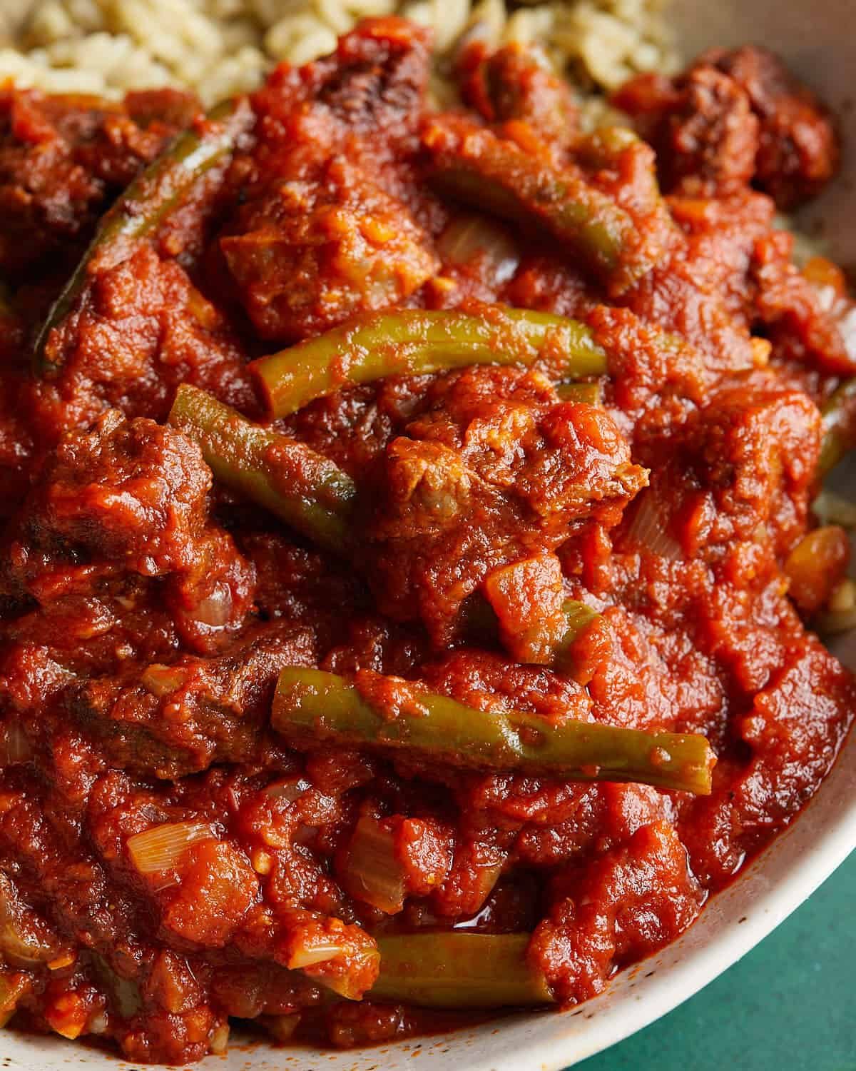 Overhead and up close image of Lebanese green bean stew with beef.