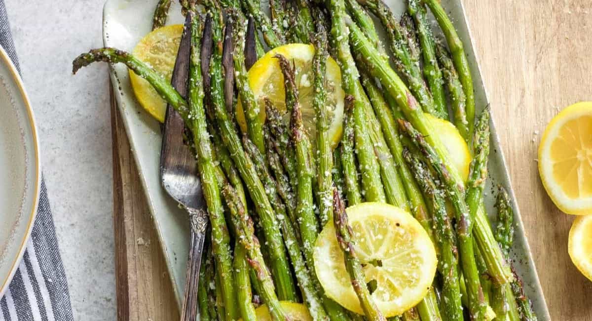Overhead image of grilled asparagus with parmesan, lemon, and garlic.