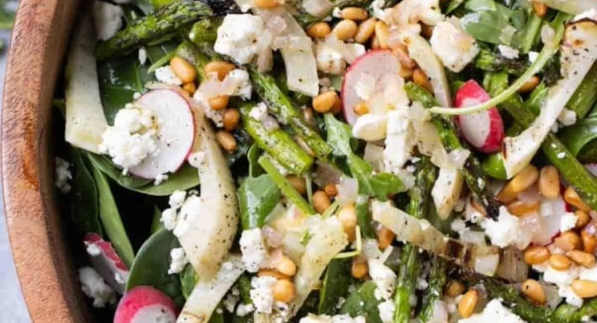 Overhead image of grilled fennel arugula salad with shallot vinaigrette.