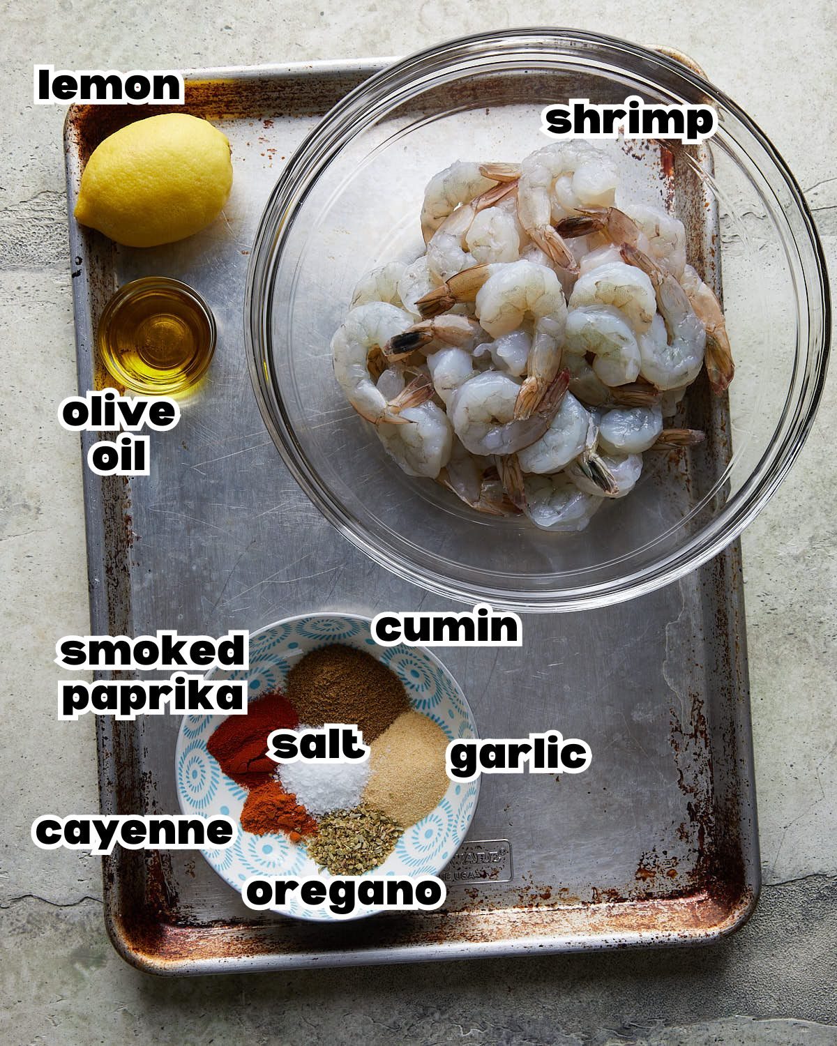 Overhead image of ingredients needed to make grilled shrimp skewers.