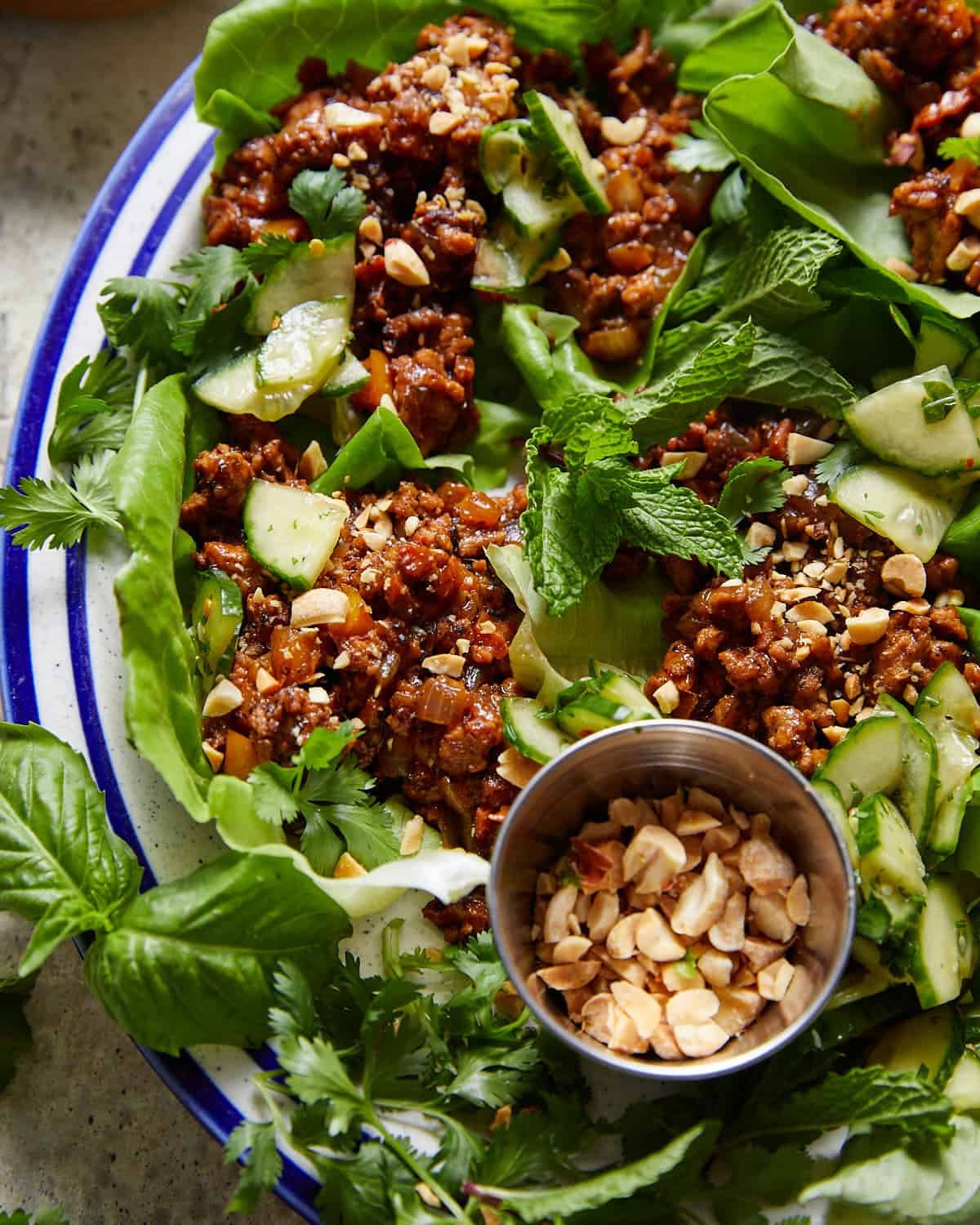 Ground chicken lettuce wrap with fresh herbs and peanuts.