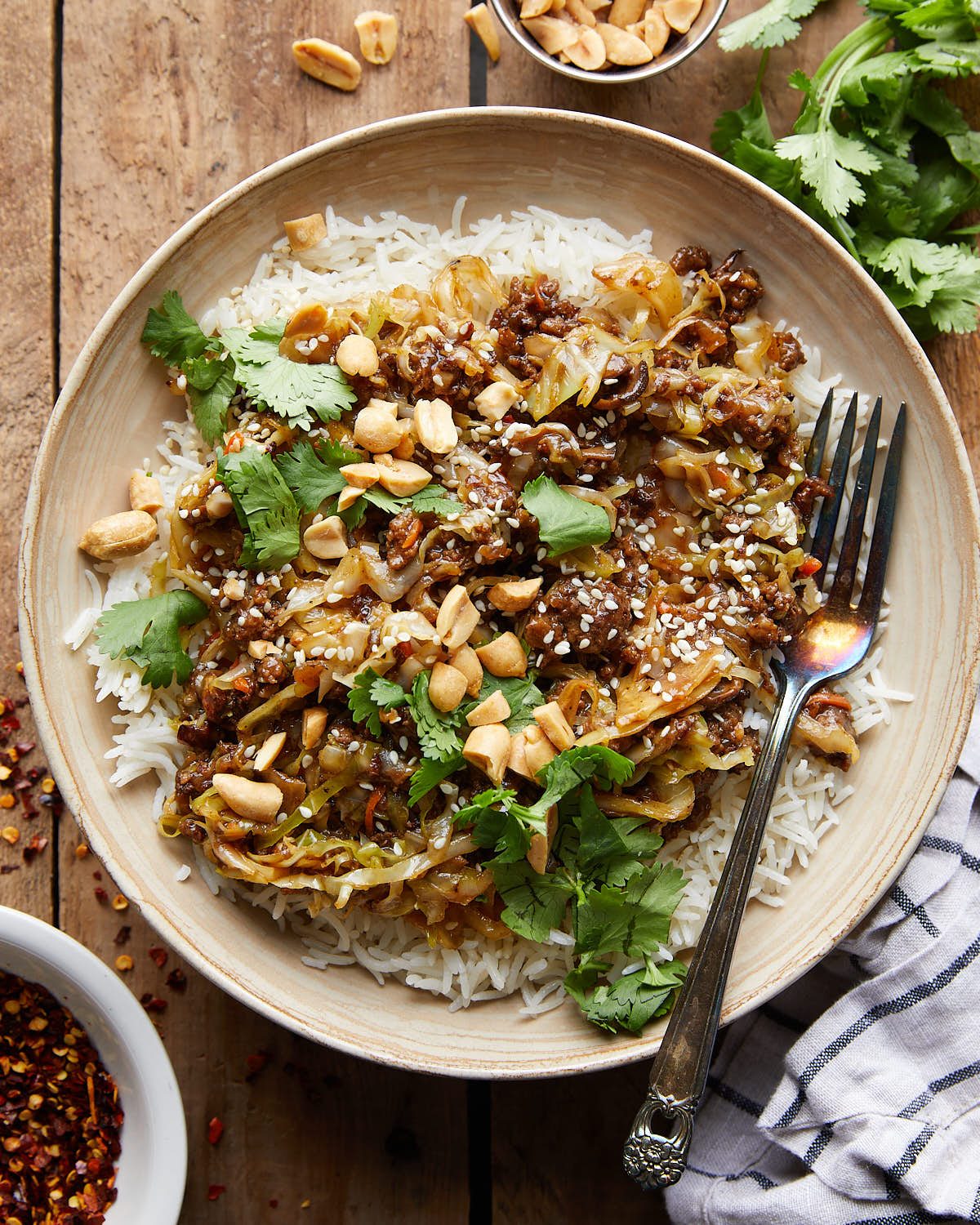 Overhead image of ground pork stir fry with garnish.
