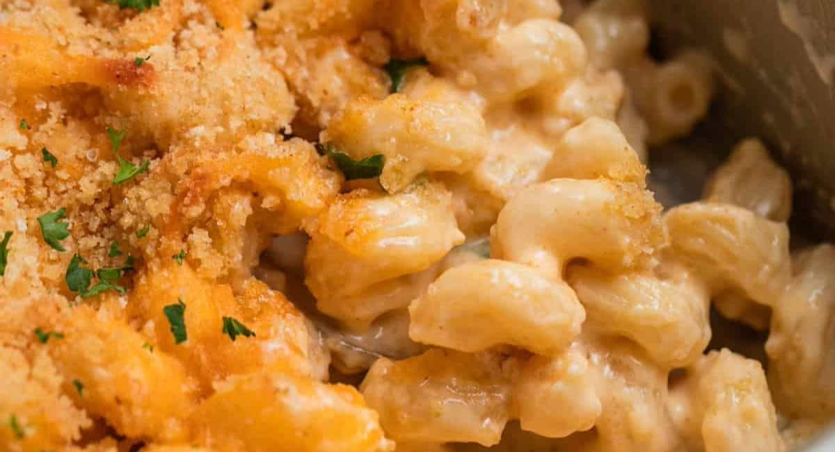 Overhead up close image of cheddar gruyere mac and cheese with garnish.