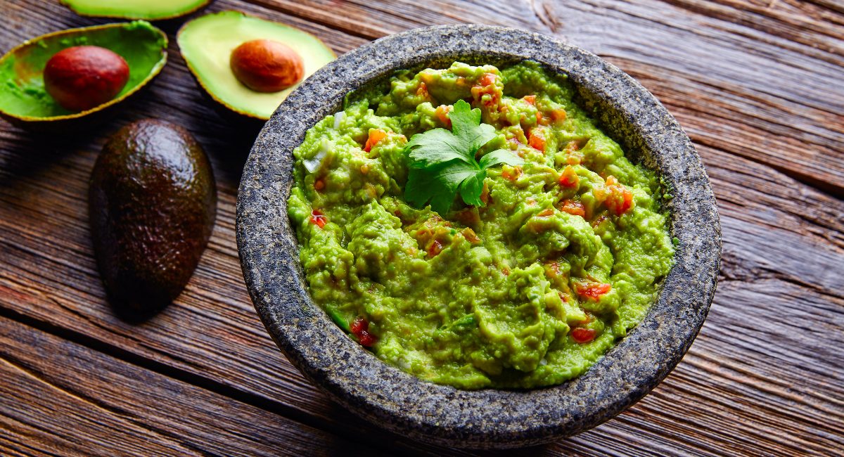 Overhead image of guacamole with garnish.