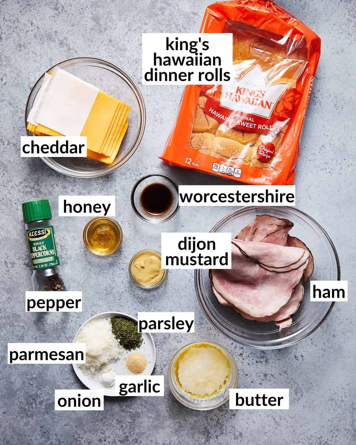 Ingredients needed for kings ham and cheese sliders in glass bowls.