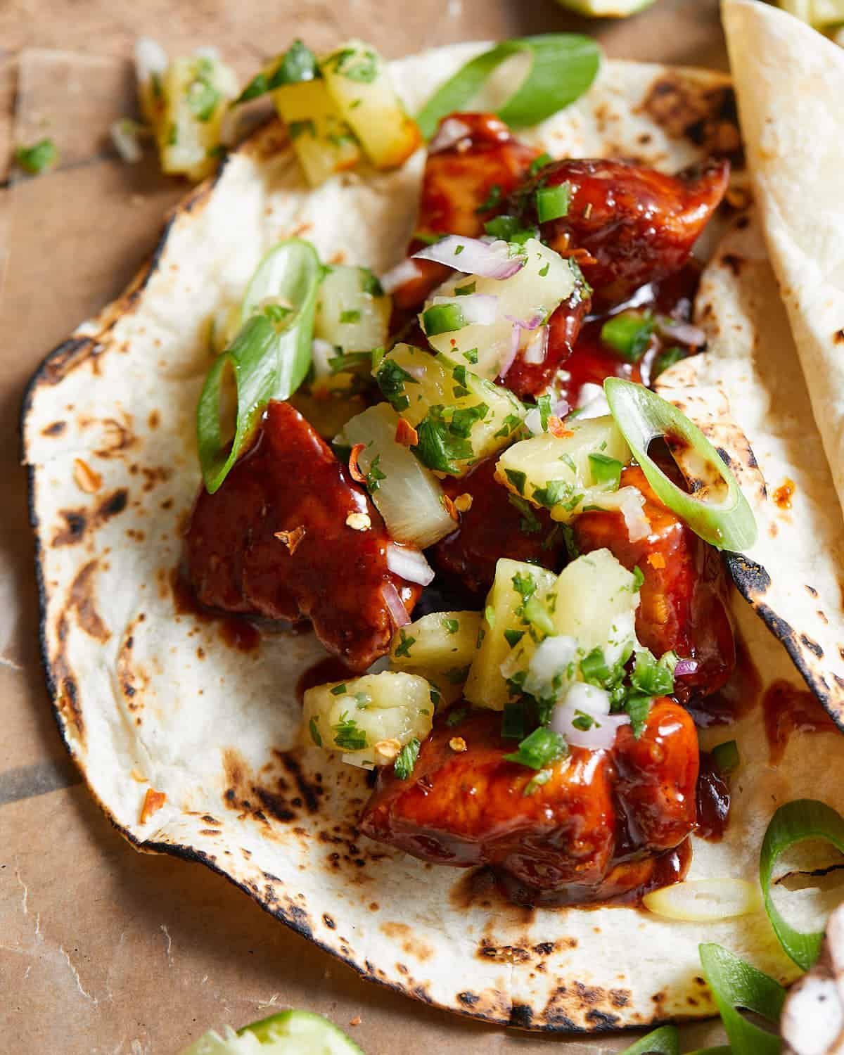 Close up image of Hawaiian chicken taco with pineapple salsa.