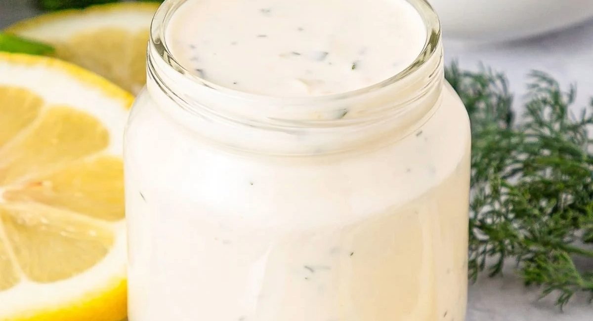 Up close image of lemon garlic and gerb aioli sauce in glass jar!