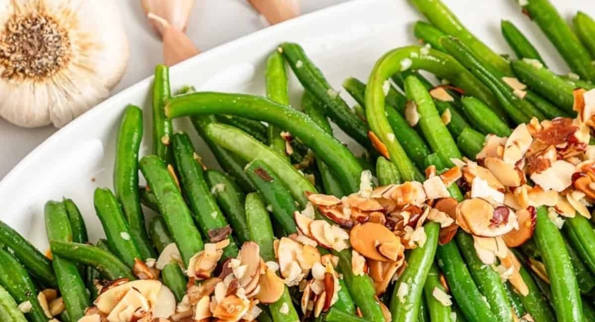 Overhead image of green beans almondine.