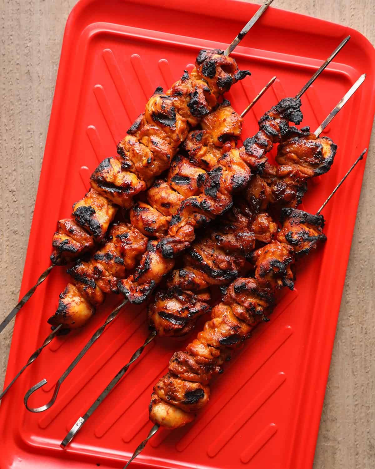 Chicken skewers grilled until browned, lightly charred, and glazed with chipotle hot honey.