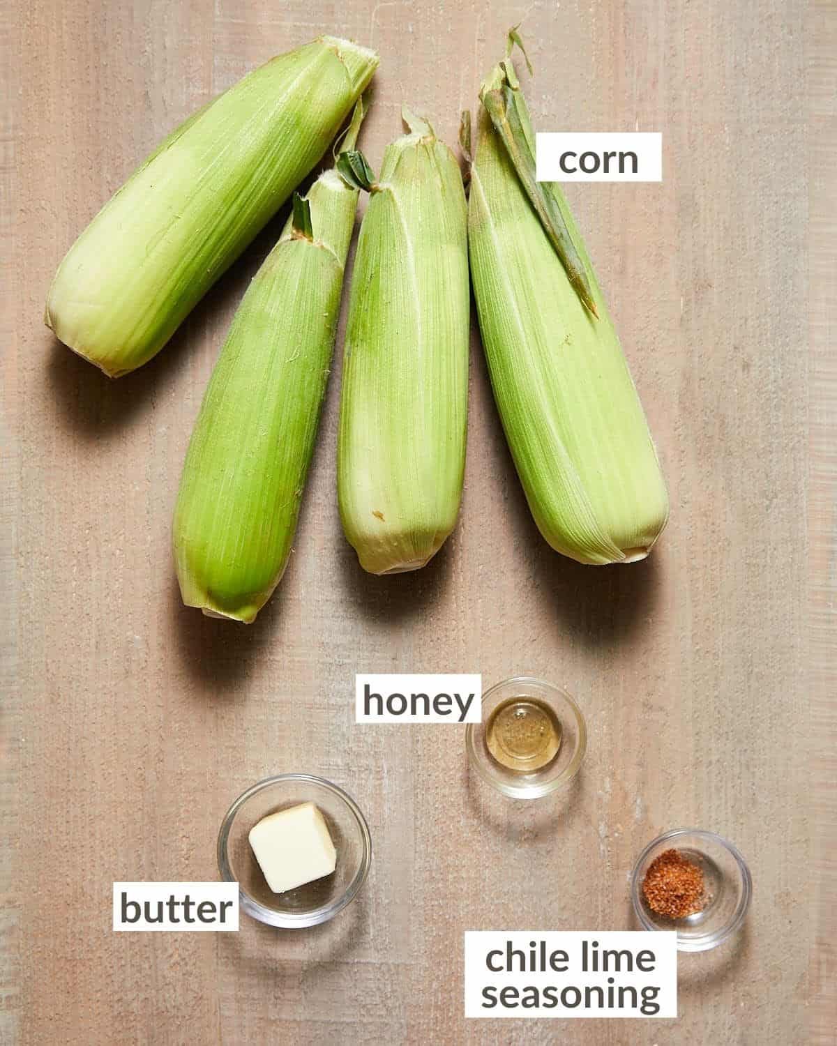 Overhead image of ingredients needed to make chili lime corn on the cob.