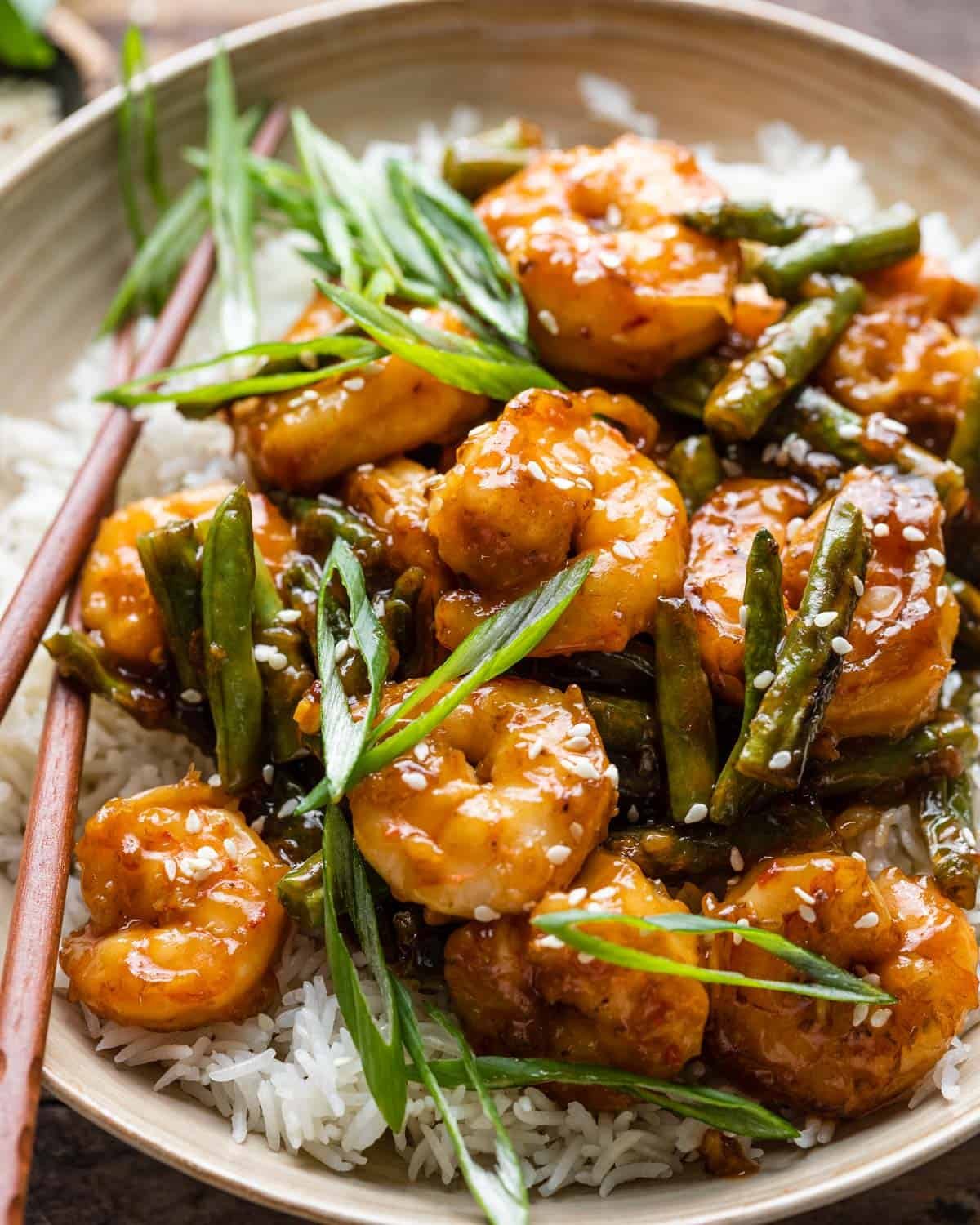 Close up of shrimp over rice in a bowl.