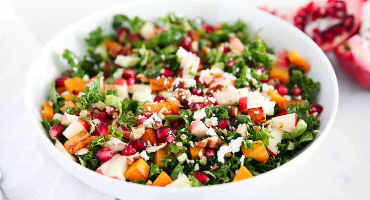 Overhead image of an easy winter salad recipe in white bowl.
