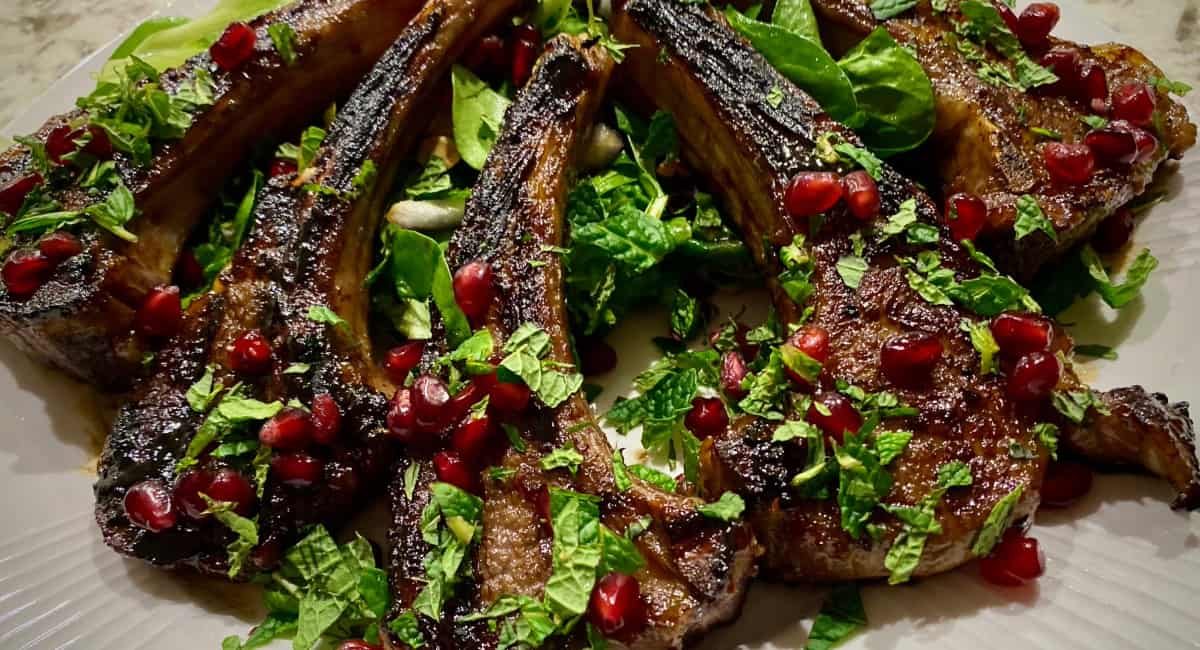 Overhead image of grilled lamb chops with pomegranate glaze.
