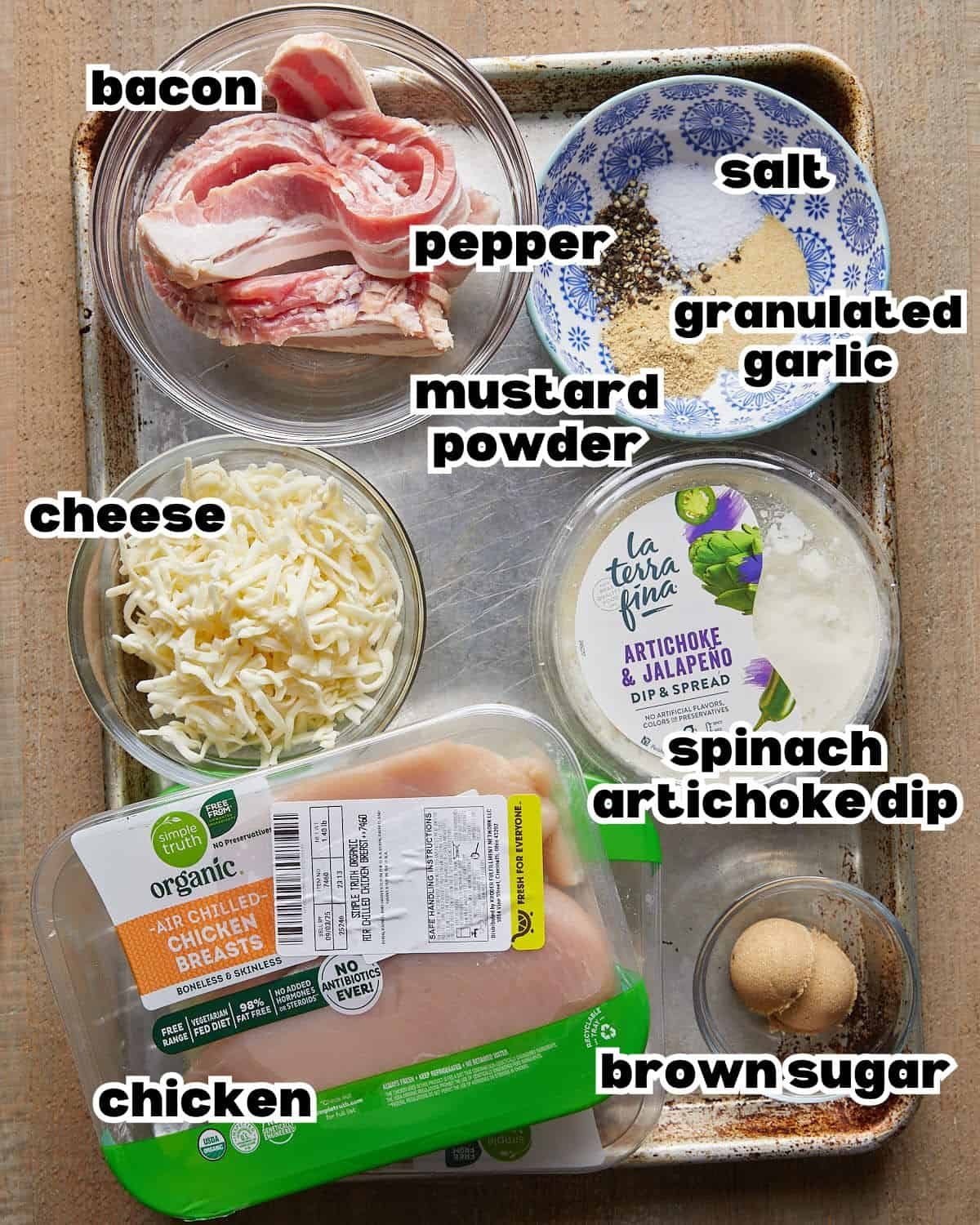 Overhead image of ingredients needed to make bacon wrapped stuffed chicken breasts.